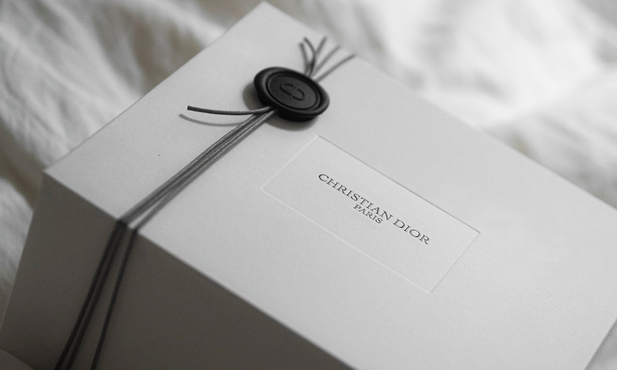 White dior gift box with wax seal and ribbon