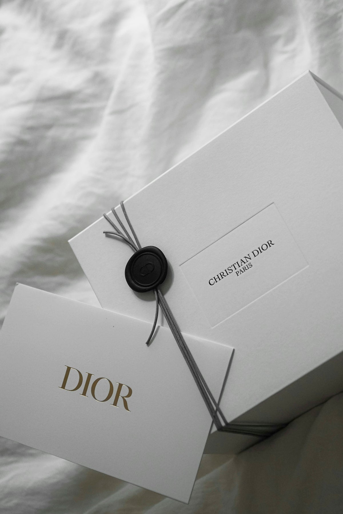 White dior box with wax seal and tag