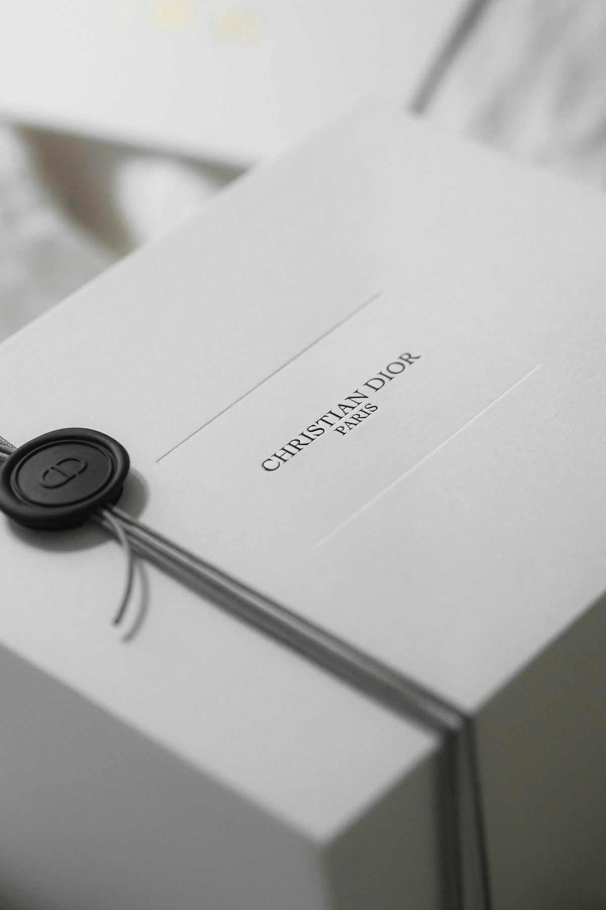 White christian dior gift box with ribbon and seal